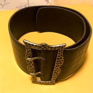 Wide crocodile black leather belt .